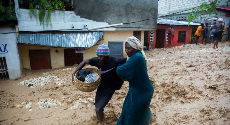 A flooded street in Haiti during the passage of Tropical Storm Laura, which is forecast to strengthen into a hurricane