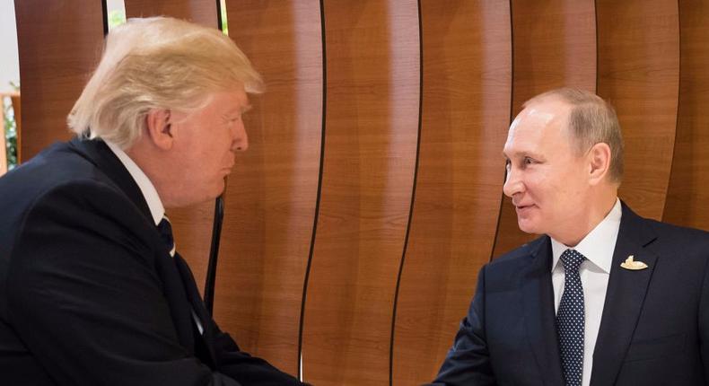 President Donald Trump meets Vladimir Putin, President of Russia (right), at the opening of the G20 summit on July 7, 2017 in Hamburg, Germany.