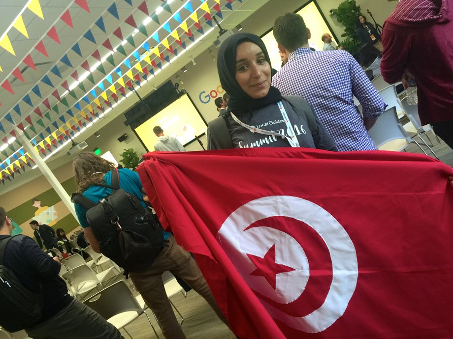 Houda Rouaissi poses with the Tunisian flag