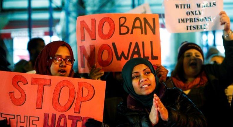 People protest against President Donald Trump's travel ban in New York.