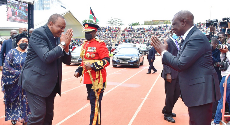 President Uhuru Kenyatta received by his deputy William Ruto at the Nyayo National Stadium on April 29, 2022 during the State Funeral Service for Mwai Kibaki