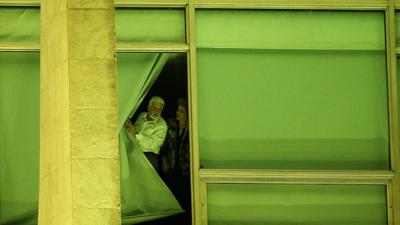 Brazil's President Rousseff and Chief of Staff Wagner look from a window at Planalto Palace in Brasi