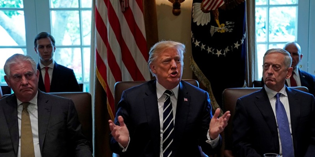 Flanked by Secretary of State Rex Tillerson and Defense Secretary Jim Mattis, President Donald Trump meets with cabinet members at the White House, October 16, 2017.