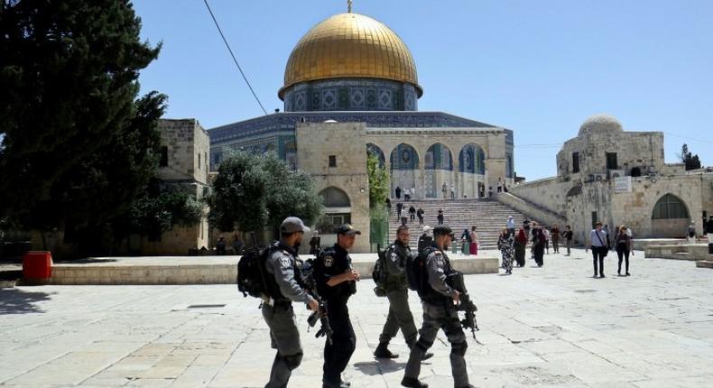 Israeli police walk past the Dome of the Rock in the compound known to Muslims as the Haram al-Sharif and to Jews as Temple Mount on May 16, 2017