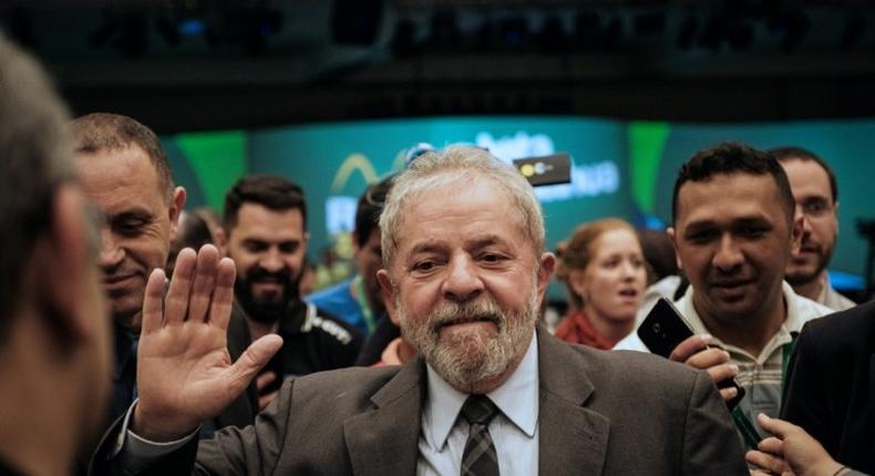 Brazil's former president (2003-2011) Luiz Inacio Lula da Silva waves during the second congress of the IndustriALL Global Union in Rio de Janeiro, Brazil