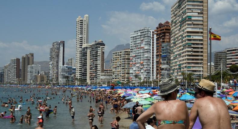 In the resort of Benidorm, pubs and English ads for mobility scooters for the elderly abound