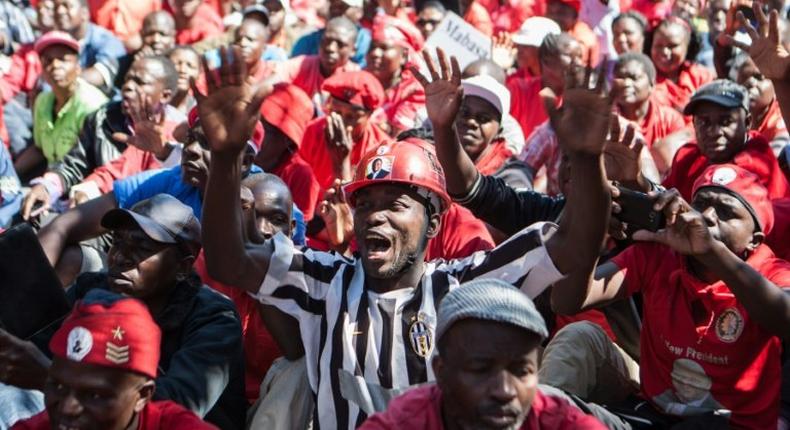Zimbabwe's opposition party supporters shout anti-government slogans during a demonstration in Gweru, on August 13, 2016 