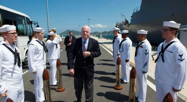 US Senator John McCain (C) visits the forward-deployed Arleigh Burke-class guided-missile destroyer USS John S. McCain docked at Cam Ranh International Port in Vietnam's central province of Khanh Hoa