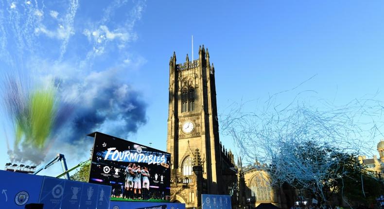 Manchester City celebrated their domestic treble with an open-top bus parade on Monday, drawing an estimated 100,000 fans to the streets of the city centre