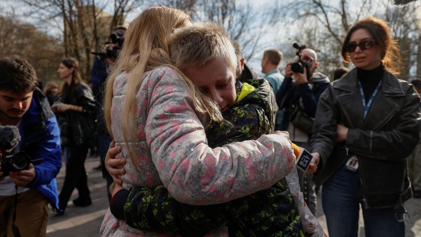 10-year-old Kira walks after crossing the Belarus-Ukraine border, in Volyn region