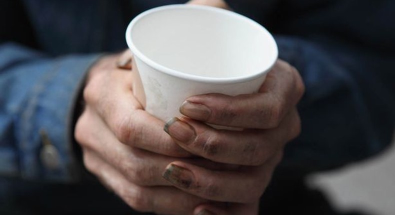 ___4569849___https:______static.pulse.com.gh___webservice___escenic___binary___4569849___2016___1___18___9___A-homeless-man-holds-a-cup