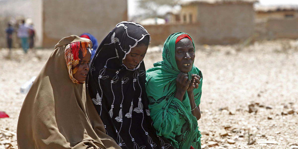Women pray as they wait for assistance at Hariirad town of Awdal region, Somaliland.