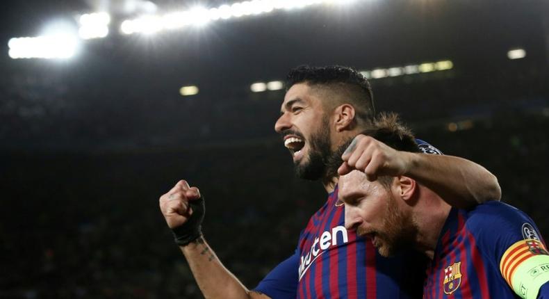 Teammates no more: Luis Suarez struck up a strong friendship with Lionel Messi at Barcelona, but the Urugayan's transfer to Atletico Madrid has been confirmed