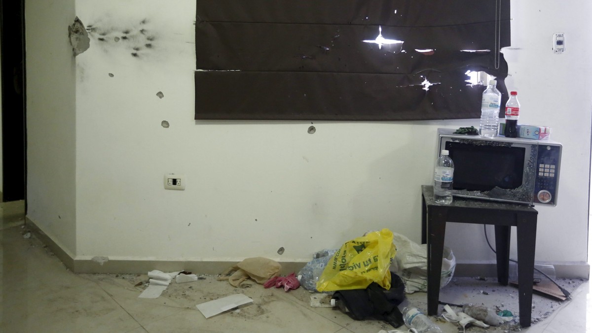 A destroyed microwave oven is seen next to a wall with bullet holes in a safe house, where five people were shot dead during an operation on Friday to recapture the drug lord Joaquin "El Chapo" Guzman, at Jiquilpan Boulevard in Los Mochis