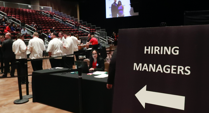 FILE - In this Tuesday, June 4, 2019, file photo, managers wait for job applicants at the Seminole Hard Rock Hotel & Casino Hollywood during a job fair in Hollywood, Fla.  U.S. businesses added 183,000 jobs in Jan. 2020, a solid gain that shows the economy was largely healthy when the coronavirus outbreak spread further around the globe. Large companies added roughly two-thirds of the jobs, while hiring among smaller firms was relatively weak. Manufacturing and mining firms shed jobs, while hiring in health care and hotels and restaurants was strong. (AP Photo/Wilfredo Lee, File)