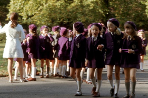 Schoolchildren in uniform walking in Hyde Park, London