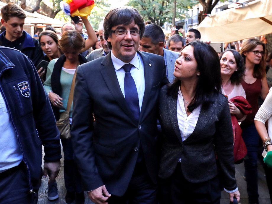 Puigdemont and his wife, Marcela Topor, in Girona on the day Catalonia declared independence last Friday.