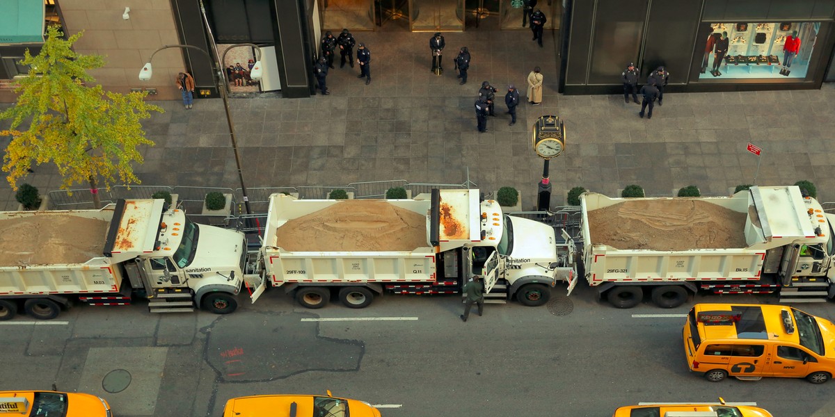 Sanitation trucks filled with sand acting as barricades along Fifth Avenue outside Trump Tower in New York City on November 8.