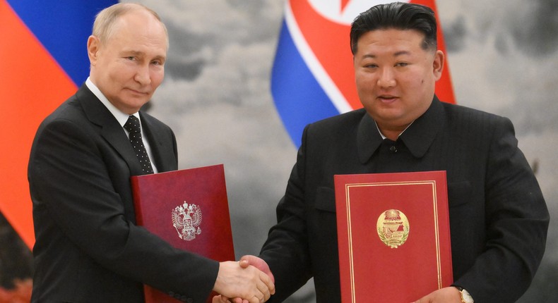 Russian President Vladimir Putin shakes hands with North Korea's leader Kim Jong Un after a signing ceremony following their bilateral talks at Kumsusan state residence in Pyongyang, on June 19, 2024.KRISTINA KORMILITSYNA/Getty Images