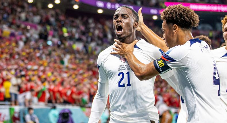 Timothy Weah (left) celebrates after scoring against Wales in the 2022 FIFA World Cup on November 21, 2022.