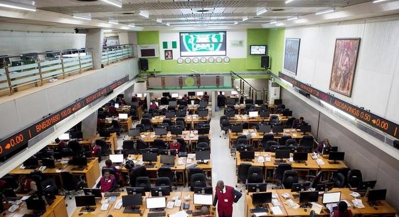 Traders work at the Nigerian Stock Exchange in Lagos