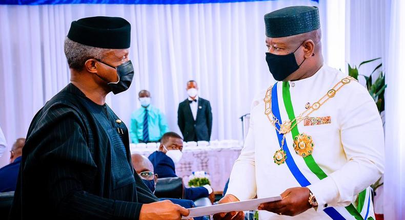 Nigeria's Vice President, Yemi Osinbajo (L) with the President of Sierra Leone, Julius Bio (R) at the country's 60th Independence Anniversary celebration. [Twitter/@jarmari01]