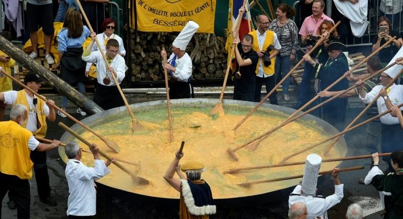 At least 1,000 people braved rainy skies to get a bite of the giant omelette in the Belgian town of Malmedy, but it was still far fewer than the record 7,000 visitors last year