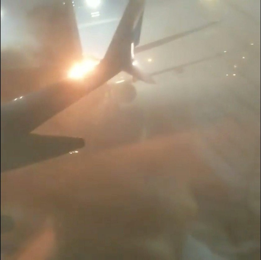 An explosion is seen through a window of a plane that has collided with another plane at Toronto's P