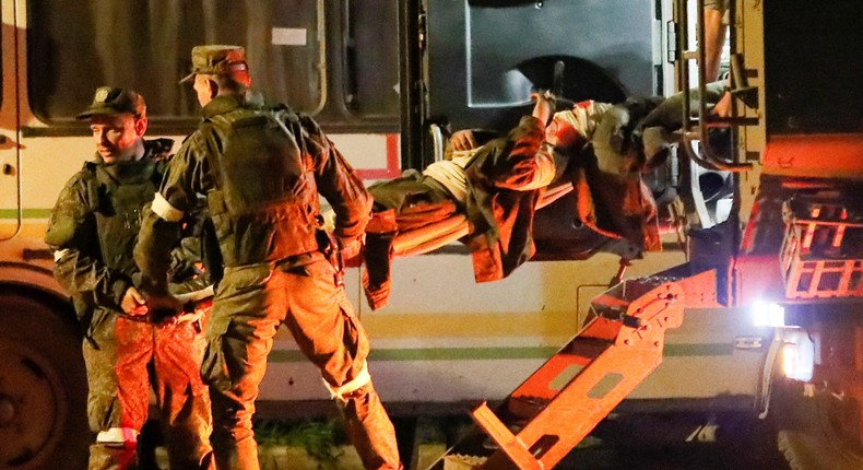 A wounded service member of Ukrainian forces from the besieged Azovstal steel mill in Mariupol is transported on a stretcher out of a bus, which arrived under escort of the pro-Russian military in the course of Ukraine-Russia conflict in Novoazovsk, Ukraine May 16, 2022