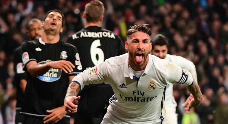 Real Madrid's captain Sergio Ramos celebrates after scoring a goal during their Spanish La Liga match against Deportivo la Coruna, at the Santiago Bernabeu stadium in Madrid, on December 10, 2016