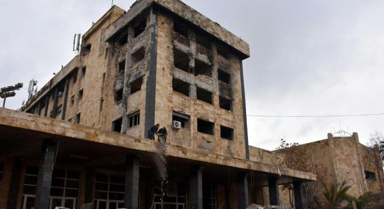 Syrian workers clean up the water pumping station in Aleppo's Suleiman al-Halabi neighbourhood