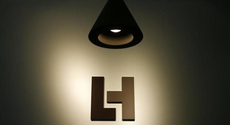 The company's new logo is pictured at the headquarters of LafargeHolcim in Zurich, Switzerland, July 15, 2015. REUTERS/Arnd Wiegmann