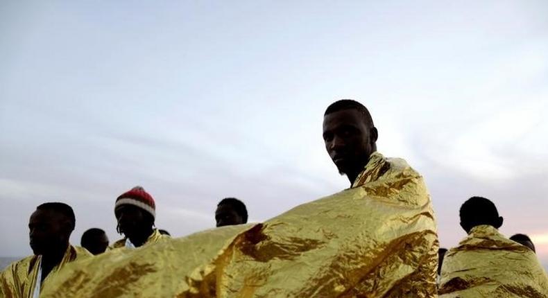 Migrants are seen onboard the rescue vessel Responder, a rescue boat run by the Malta-based NGO Migrant Offshore Aid Station (MOAS) and the Italian Red Cross (CRI), before arriving in the Italian harbour of Vibo Marina, Italy October 22, 2016. 