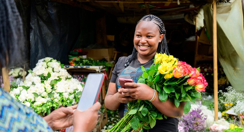 A woman at a market in Nairobi, Kenya. The country is currently piloting one of the world's largest basic income programs.JohnnyGreig / Getty Images