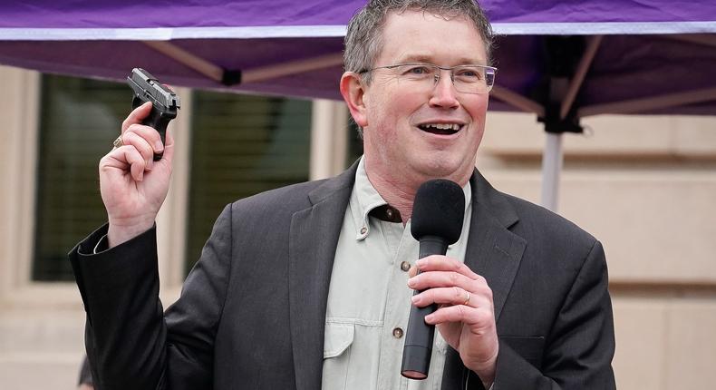 Rep Thomas Massie (R-KY) draws a Ruger LCP handgun from his pocket during a rally in support of the Second Amendment on January 31, 2020 in Frankfort, Kentucky.