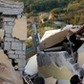 Collapsed houses are seen after an earthquake hits the island of Ischia, off the coast of Naples