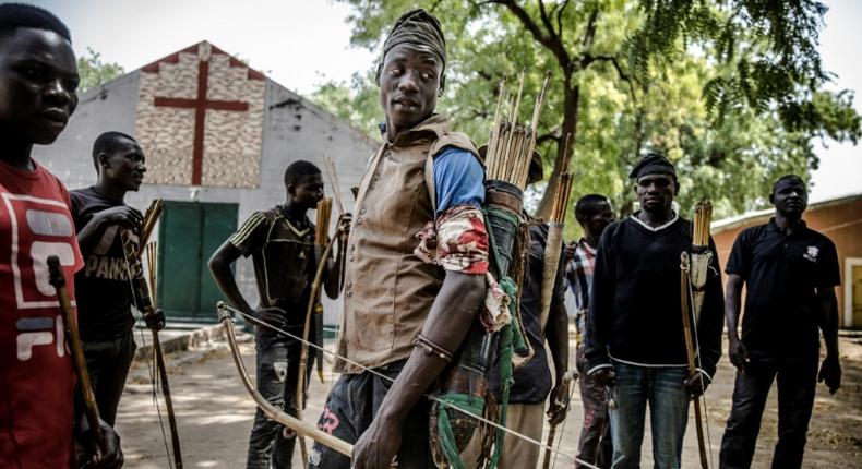 Land of tensions: Hunters armed with bows and arrows gathered in Dasso, central Nigeria, in February pledging to defend farmers in conflict with nomadic herdsmen