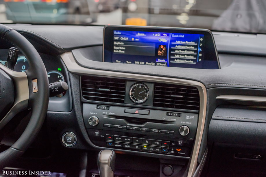 The infotainment system runs off a substantial center screen that's controlled with a puck-like thingy that resides between the seats. The screen doesn't retract, and while it satisfies all the necessary functions — audio, navigation, Bluetooth connections, and so on — it simply doesn't feel as up-to-date as what you can get in a Cadillac, Audi, or BMW.