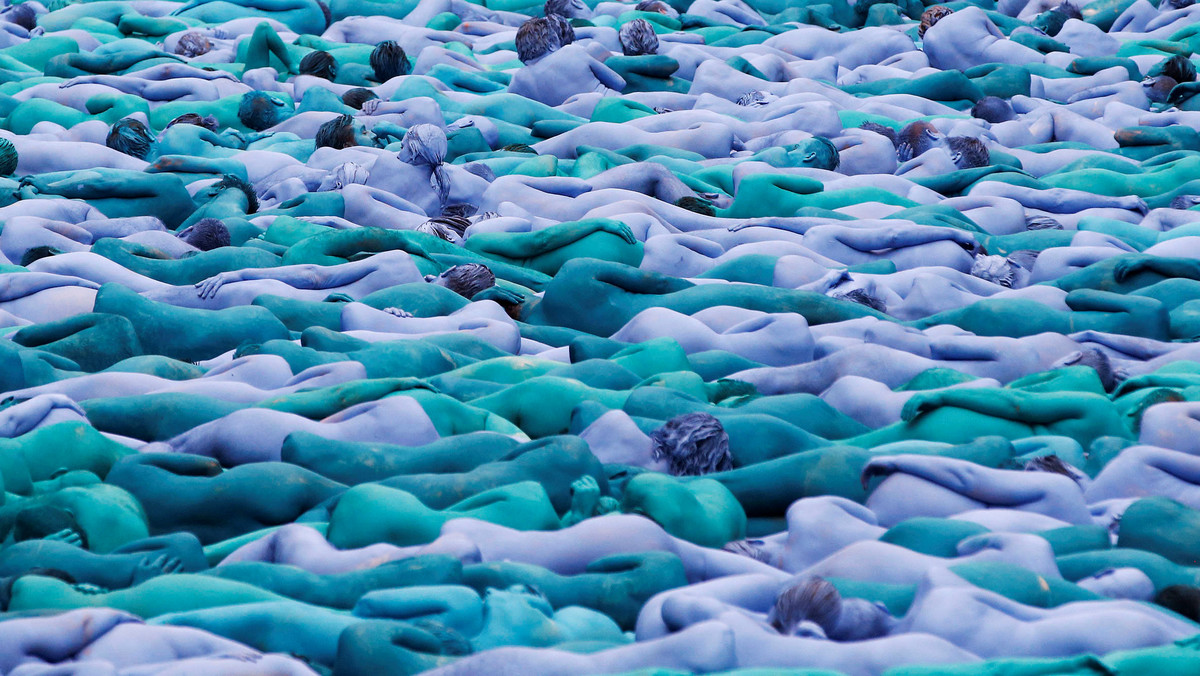 Nude models pose for a photograph by U.S. artist Spencer Tunick, for a project titled "Sea of Hull" in Hull