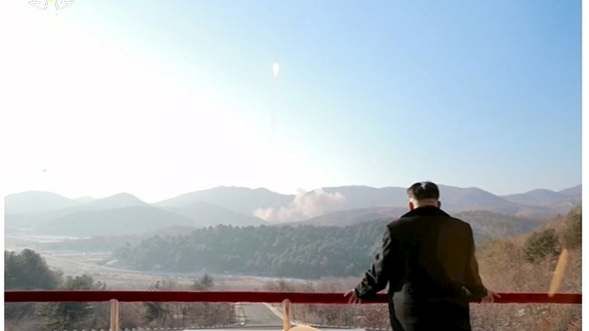 North Korean leader Kim Jong Un watches a long range rocket launched into the air in this still image taken from KRT footage and released by Yonhap