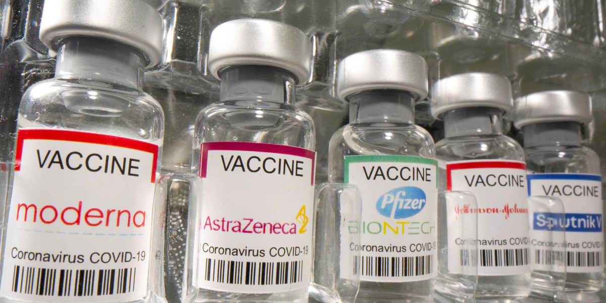 Vials labelled "AstraZeneca, Pfizer - Biontech, Johnson&Johnson, Sputnik V coronavirus disease (COVI