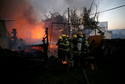 Firefighters work as a wildfire burns in the northern city of Haifa, Israel