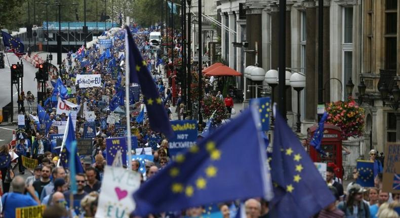 People carry EU flags during a March for Europe protest against the Brexit vote in London in September 2016