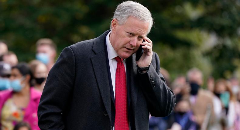 White House chief of staff Mark Meadows speaks on a phone on the South Lawn of the White House in Washington, Friday, Oct. 30, 2020, before President Donald Trump's departure on Marine One.