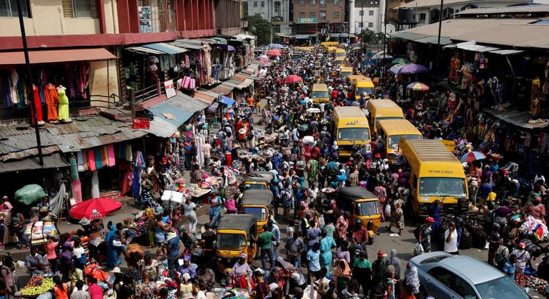 People crowd a street in Lagos ahead of Christmas in 2016 (Punch).