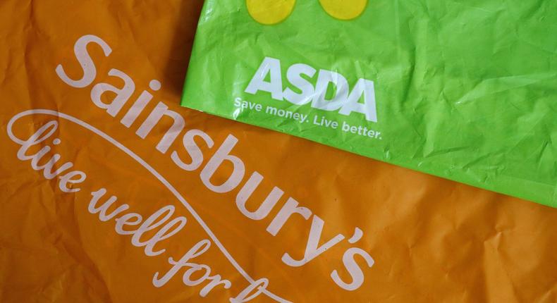 Shopping bags from Asda and Sainsbury's are seen in Manchester, Britain April 30, 2018.