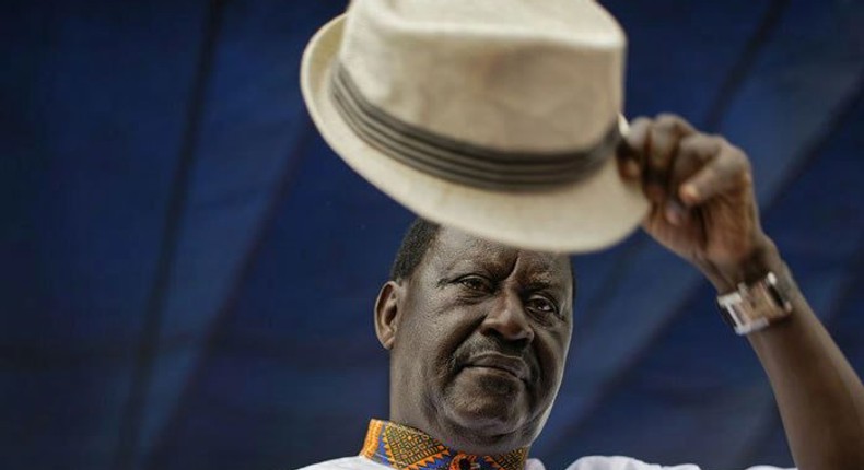 Special AU envoy Raila Odinga gives his trademark salute for the dead for 8 pupils who died at Precious Talents School 