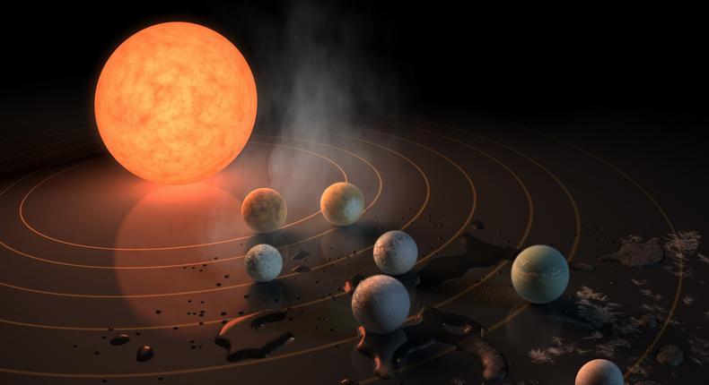 An artist's concept of the TRAPPIST-1 star, an ultra-cool red dwarf with seven Earth-size planets orbiting it.