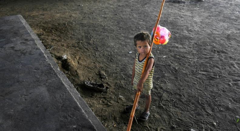 A child is seen in Karachi, Pakistan -- the majority of children at risk of poverty live in South Asia and sub-Saharan Africa, but the coronavirus pandemic will see a surge in Europe and Central Asia, a study shows