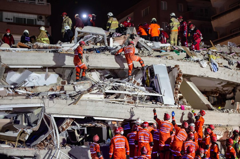 Rescue operations take place on a site after an earthquake struck the Aegean Sea, in the coastal pro